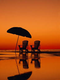 Picturesque Scene With Two Chairs And An Umbrella On The Beach Photographic Print Michael Melford Allposters Com Reflection Pictures Sunset Beautiful Sunset