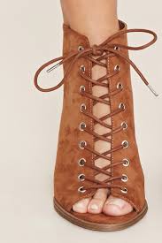 Holding the pencil perfectly vertically and perpendicular to the paper, mark the longest toe (generally the big toe) and the back of the heel, by tracing a line as. Forever 21 Synthetic Lace Up Peep Toe Booties In Tan Natural Lyst