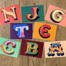 Alphabet of uppercase letters compiled from colourful magazine cutouts. Alphabet Postcards Merchandise Stationery Carters Steam Fair