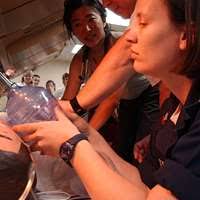 US Navy 050205-N-8796S-019 Hospital Corpsman 2nd Class Danielle Dinger  resuscitates a mock patient using a bag valve mask