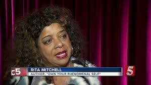 Rita Mitchell discusses book at signin