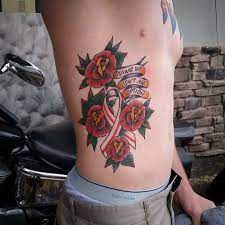 Great way to combine a feather tattoo with the pink breast cancer awareness ribbon. 130 Inspiring Breast Cancer Ribbon Tattoos August 2021