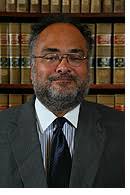 Prof. Llewellyn Gibbons accepts University's Outstanding Research and  Scholarship Award