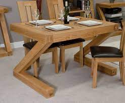 Standing on four clawed feet resting on balls, rendered in ornamental cast iron with an oak. Homestyle Gb Z Designer Oak Small Dining Table Cfs Furniture Uk