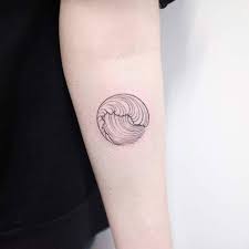 What kind of ink do japanese wave tattoos use? Circular Hokusai Wave Tattoo On The Left Forearm By Dogma Noir Tiny Tattoos For Women Waves Tattoo Wave Tattoo Design