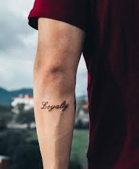 40 Awesome Minimalist One Word Tattoo Ideas Millions Grace Loyalty Tattoo Elegant Tattoos One Word Tattoo