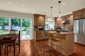 A mixture of custom built flat panel cabinetry covered with striking natural stone accenting the stove are you ready to begin your kitchen remodel or new construction project? Bellevue Whole House Remodel Mcadams Remodeling Design