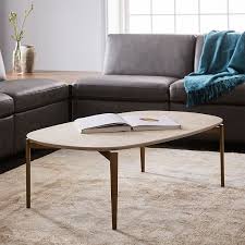 A round coffee table comes in many styles in this west elm collection, including sturdy wood. Bridging Ellipse Coffee Table