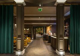 Ceiling exposed coffered 'waffle' concrete slab treated timber fins and vertical timber panels with recessed lights. Lighting Design Edinburgh Susan Lake Lighting Design