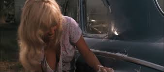 She knows exactly what she's doin'.she's drive 'n us crazy 'nd love it every minute of it!'' Cool Hand Luke 1967