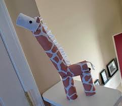 This adorable giraffe is made completely from toilet paper cardboard tubes and some printed felt. Cardboard Tube Giraffe Crafts By Amanda