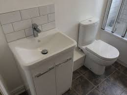 cloakroom vanity unit with metro tiles