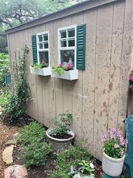 Black/bronze plastic window box plants look beautiful in the 15 in. Ash Tree Cottage Daily She Shed Windows Installed