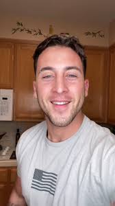 Guy Eating Eggs and Then Flexing Muscles