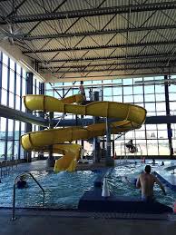 Ride The Slide Inside The Indoor Swimming Pool And Waterslides At The East Oakland Sports Center Are Fun For Indoor Pool Parties Summer Pool Party Indoor Pool