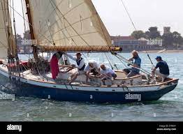 Old Gaffer tanned sail sailing in Yarmouth Festival Jubilee nostalgic  Celebrations Stock Photo - Alamy