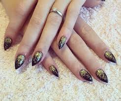 Black And Gold Glitter Nails Black Stilettos With Gold Glitter Fade Sculpted Stilettos Black Gold Acrylic Nails Christmas Glitter Nails Hair And Nails Nail Designs