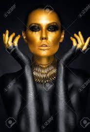 Don't you just love the classic combo of black and gold? Beautiful Woman Portrait In Gold And Black Colors Stock Photo Picture And Royalty Free Image Image 59774563