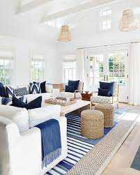Open Coastal Living Room Decorated With Dark Rich Blues Beach House Living Room Cottage Living Rooms Coastal Living Rooms