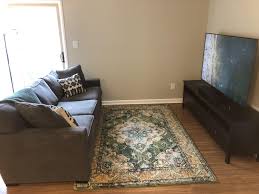 Small pouf covered with thick material and decorated with sophisticated ornamentation. Need Advice On A Coffee Table Or Pouf Ottoman For Small Living Room Area Malelivingspace