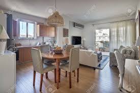 Shop items you love at overstock, with free shipping on everything* and easy returns. Open Concept Of A Kitchen Dining Wooden Table And Living Room With Balcony In A Very Small Apartments Stock Photo Picture And Royalty Free Image Image 150139629