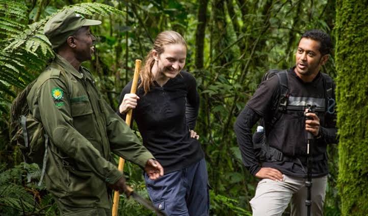 Guide leading visitors through a nature reserve, Northern Pride Group Tourism, Gulu