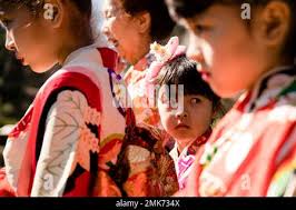 Julia Casey, 8, left, Fumiyo Batta, Reika Nishiyama, 6, and Alyssa Casey,  6, take part a news conference opening the 2019 Subaru Cherry Blossom at  the Shofuso Japanese House and Gardens in Philadelphia, Wednesday, April 3,  2019. (AP Photo/Matt ...