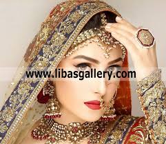 ayeza khan showing sophisticated heavy bridal designer jewellery set design  including matha patti earrings big ring and necklace qatar kuwait saudi  arabia