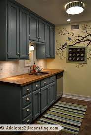 Before painting, a careful sanding and good primer set the stage for a smooth, durable top coat for painting kitchen cabinets. Before After My Kitchen Finally Finished Addicted 2 Decorating Kitchen Remodel Idea Painting Kitchen Cabinets Home Kitchens