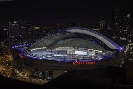A golf field is situated within a range of 3 km. A Night Time View Of The Rogers Center In Downtown Toronto As The Dome Begins To Close Toronto
