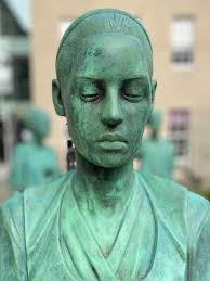 These four life-sized statues in the grounds of the Royal College of  Surgeons of Edinburgh were collectively the first memorial in Scotland to  NHS staff who worked through the pandemic.