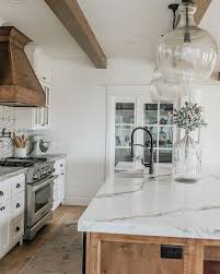 Love Mix Of Wood Island Hood And White Cabinets Also Love The Countertop And Pend Farmhouse Kitchen Countertops Kitchen Design Countertops Home Decor Kitchen