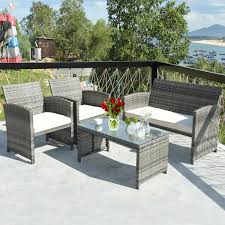Crafted from wicker rattan, with a glass coffee table top, and detachable seat cushions that are crafted from a polyester blend fabric and foam filling. 4pcs Rattan Wicker Patio Furniture Set Garden Lawn Sofa Cushioned Seat Mix Walmart Canada