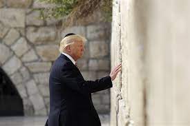 A man holds up a copy of israeli newspaper israel hayom with biden proudly grinning. Trump Becomes First Sitting U S President To Visit Western Wall