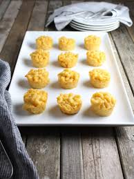 Fill the wells of the muffin tins to the top with macaroni, using damp fingertips to pack the macaroni into the tins. Mac N Cheese Bites Taste And See