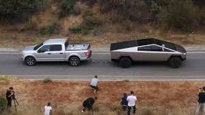 Not the kind of america that drives pickup trucks, rolls coal, and head down to the so tesla is emphasizing how tough the truck is. Tesla Cybertruck Wins Uphill Tug Of War With Ford F 150 In Video Tesla Ford F150 Electric Truck