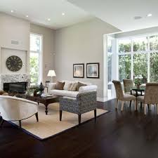 Dark gray tones are juxtaposed with bright shades of yellow, green, and orange in this funky and fun living room. Dark Floor And Light Walls Living Room Ideas Photos Houzz