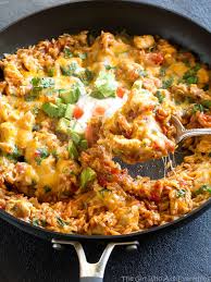 One Pan Mexican Chicken And Rice The Girl Who Ate Everything Recipe Mexican Chicken And Rice Mexican Chicken Recipes Mexican Food Recipes