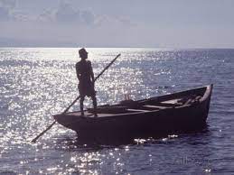 Haitian Man On Small Boat Out In The Ocean Premium Photographic Print By Lynn Pelham At Allposters Com Boat Small Boats Ocean
