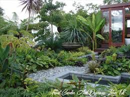 Create a stylish welcome with a front yard that's both beautiful and practical. 11 Front Garden And Driveway Ideas Uk Tropical Garden Design Tropical Landscape Design Small Backyard Gardens