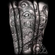 This reaches from the top of the shoulder to the wrist. 37 Black And White Octopus Tattoos