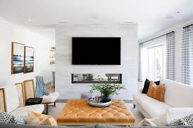 Double sided gas fire bowl installation.we have three different styles of gas fire bowl available and these can be installed in a double sided or see through enclosure to create a feature fireplace to divide a room or living area. Double Sided Fireplace With White And Gray Staggered Tiles Transitional Living Room