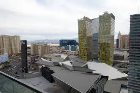 Sliding glass doors open to an oversized private terrace with a spectacular view, allowing fresh air and sunlight to pour into the room's spacious interior. Review The Cosmopolitan Of Las Vegas Terrace One Bedroom