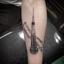 Grey music notes and microphone tattoo drawing. 37 Perfect Musical Tattoos You Ll Really Really Want Tattooblend