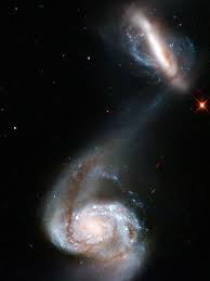Meet ngc 2608, a barred spiral galaxy about 93 million light years away, in the constellation cancer. Interacting Galaxy Pair Two Galaxies Known Collectively As Arp 87 Distort As Their Gravitational Fields Inte Hubble Pictures Hubble Space Telescope Galaxies