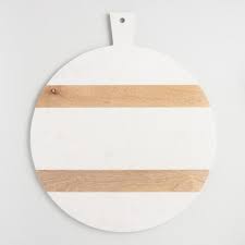Cutting board—cutting on metal, glass or marble surfaces will dull and eventually Large Round White Marble And Wood Paddle Cutting Board World Market