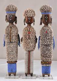 Black big doll isolated on white background. History Of African Dolls Galamaga