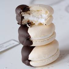 White Cake Macarons Dipped In Chocolate Macarons Macaroons Macaroon Recipes Macaroons