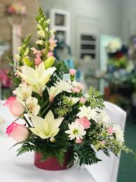 The mixed bush floral arrangement isn't just known for being the best choice for grave and cemetery flowers but they also look really beautiful in home lawns and gardens. Graves Modern Table Arrangement By Graves Floral