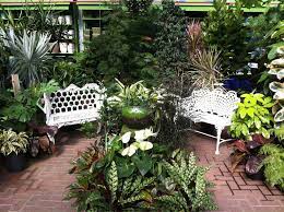 A Cozy Set Up In Gethsemane Garden Center S Greenhouse Using Many Greenhouse Plants A Fountain And Some Seating Garden Styles Greenhouse Plants Garden Center